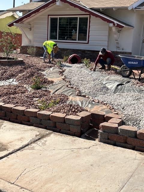 Elevated patio and retaining wall landscape design in a Las Vegas front yard