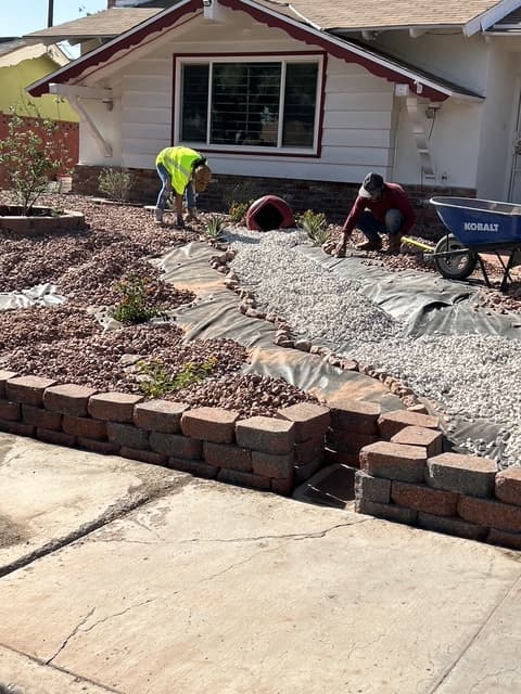 Elevated patio and retaining wall landscape design in a Las Vegas front yard